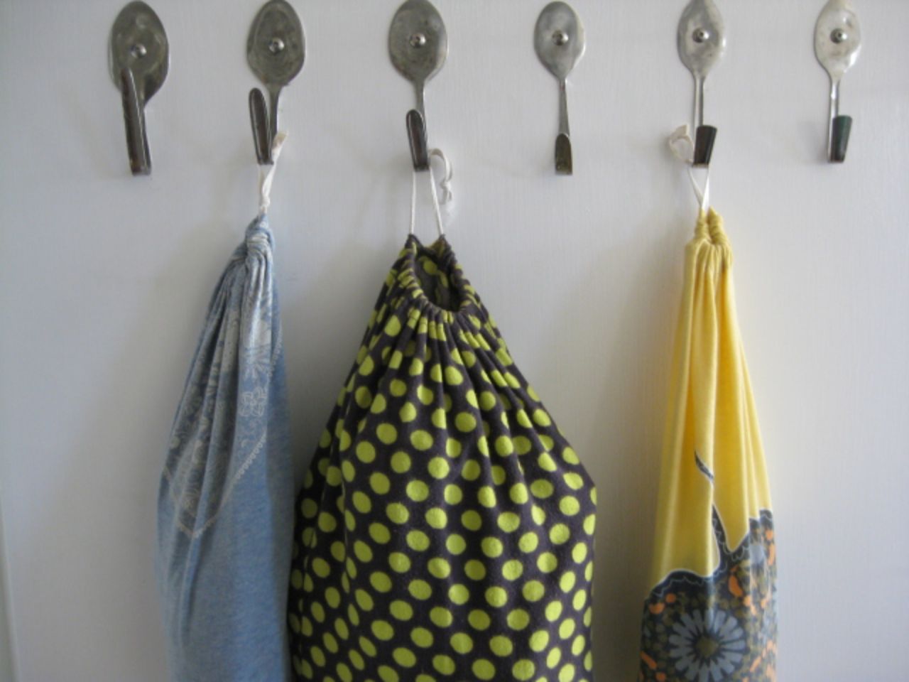 Repurposed old clothes for reusing and recycling storage tubes