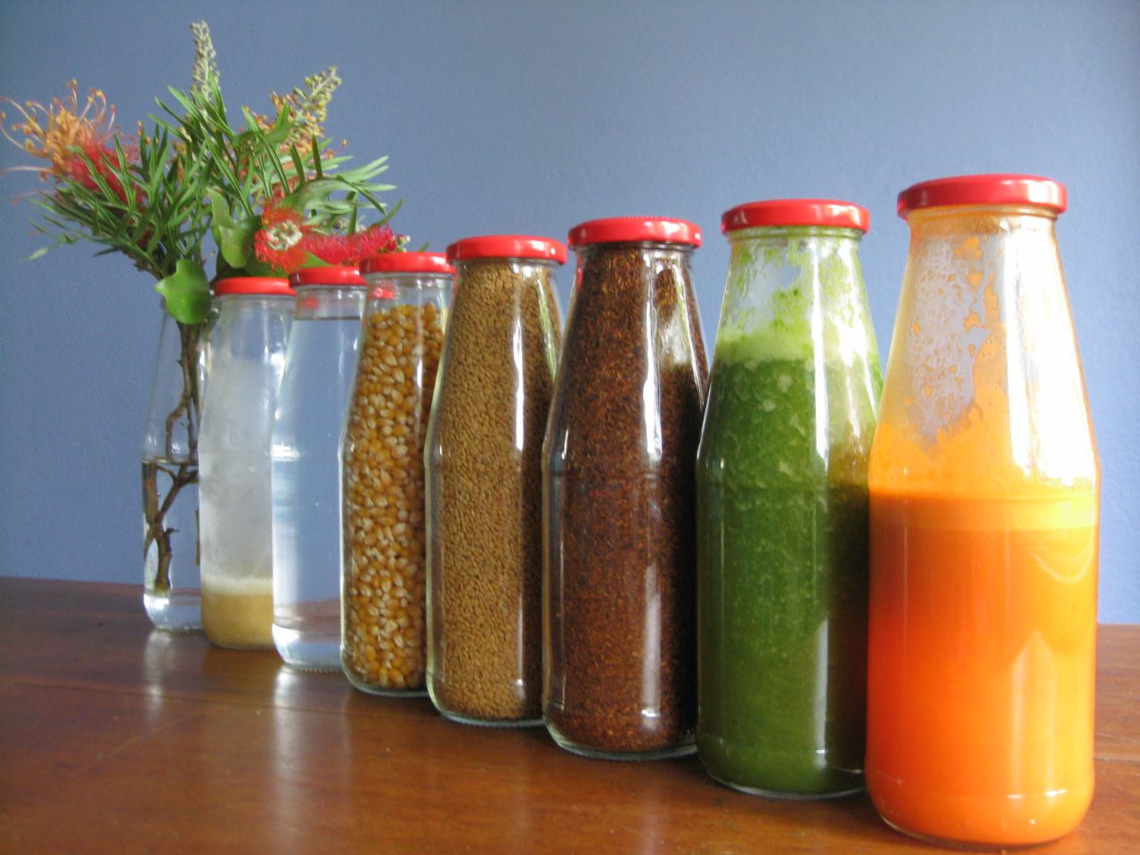 glass passata bottles being reused for different purposes - angled line